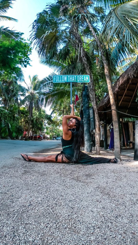 Christine Lozada at Follow Your Dreams sign Tulum