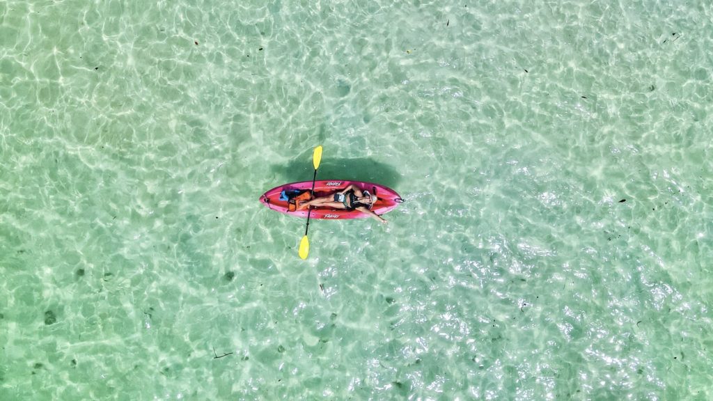 Christine Lozada droning from a kayak in Oahu