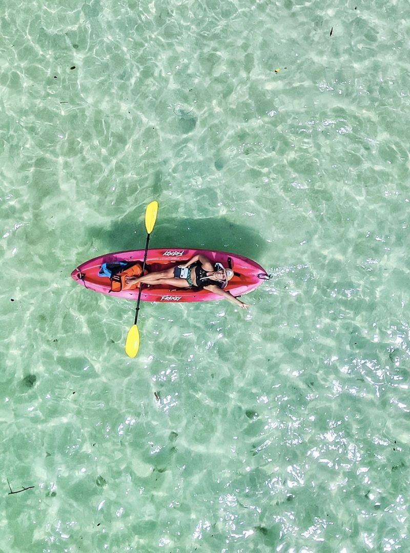 Christine Lozada droning from a kayak in Oahu
