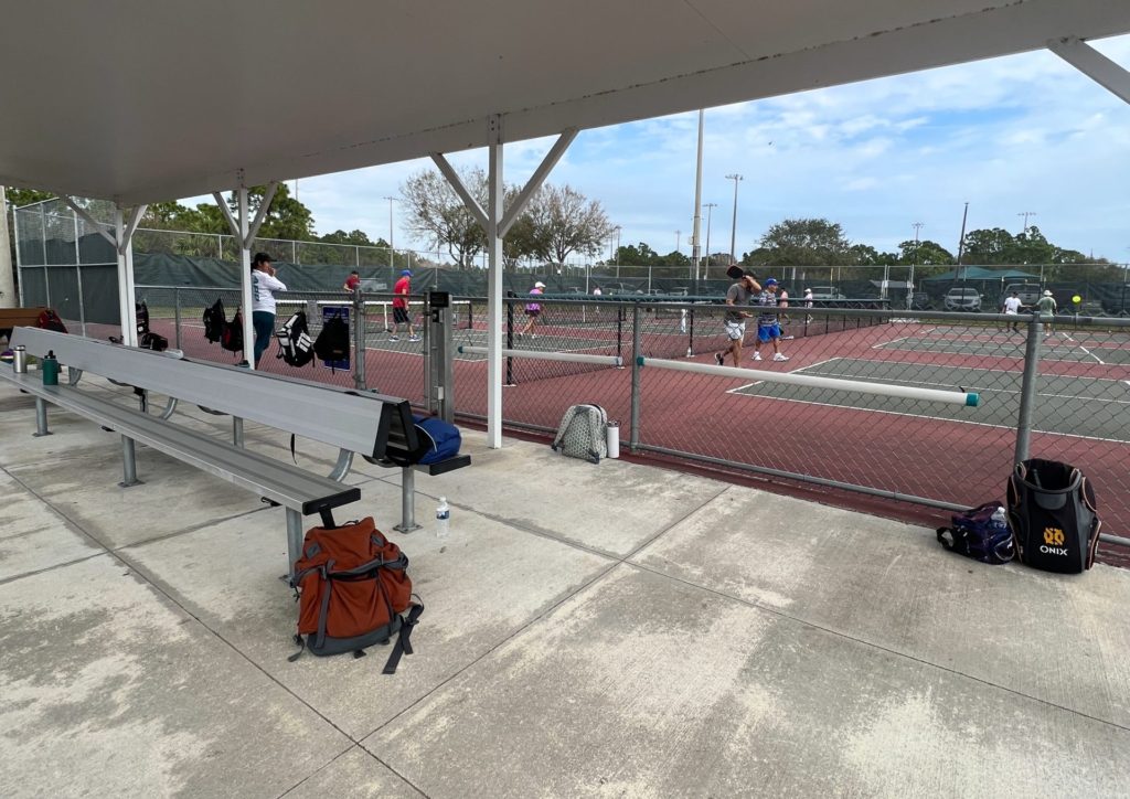 The seating area that is between the 12 courts. You'll find 6 on either side.