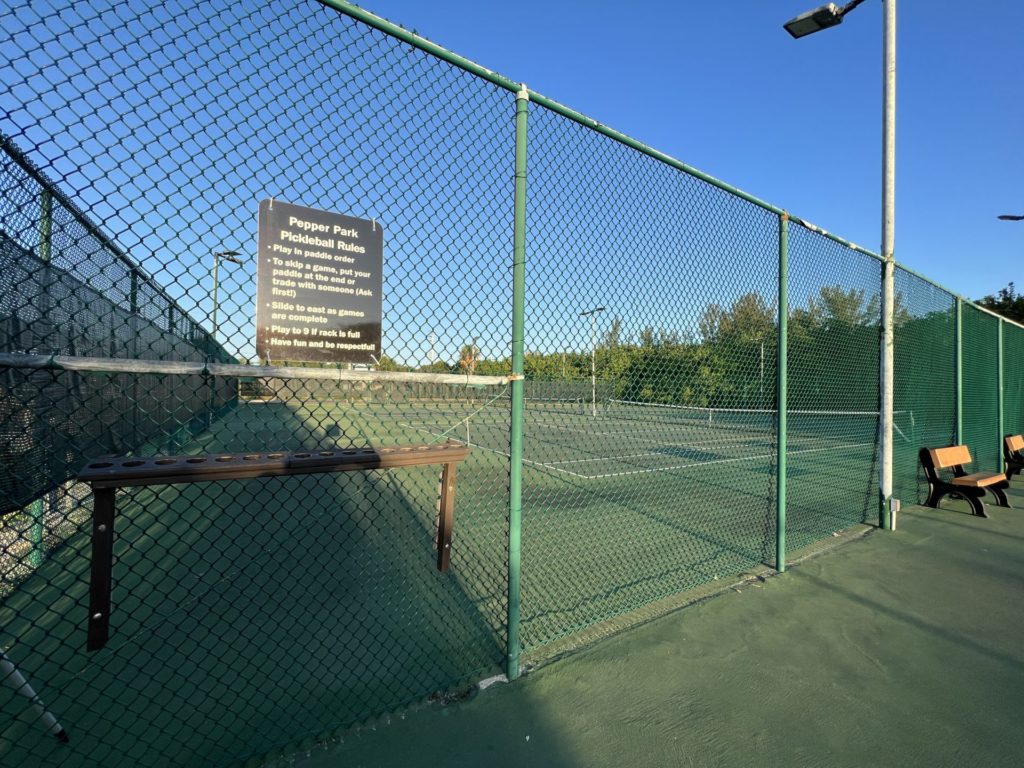 Pickleball paddle lineup at Pepper Park Beachside